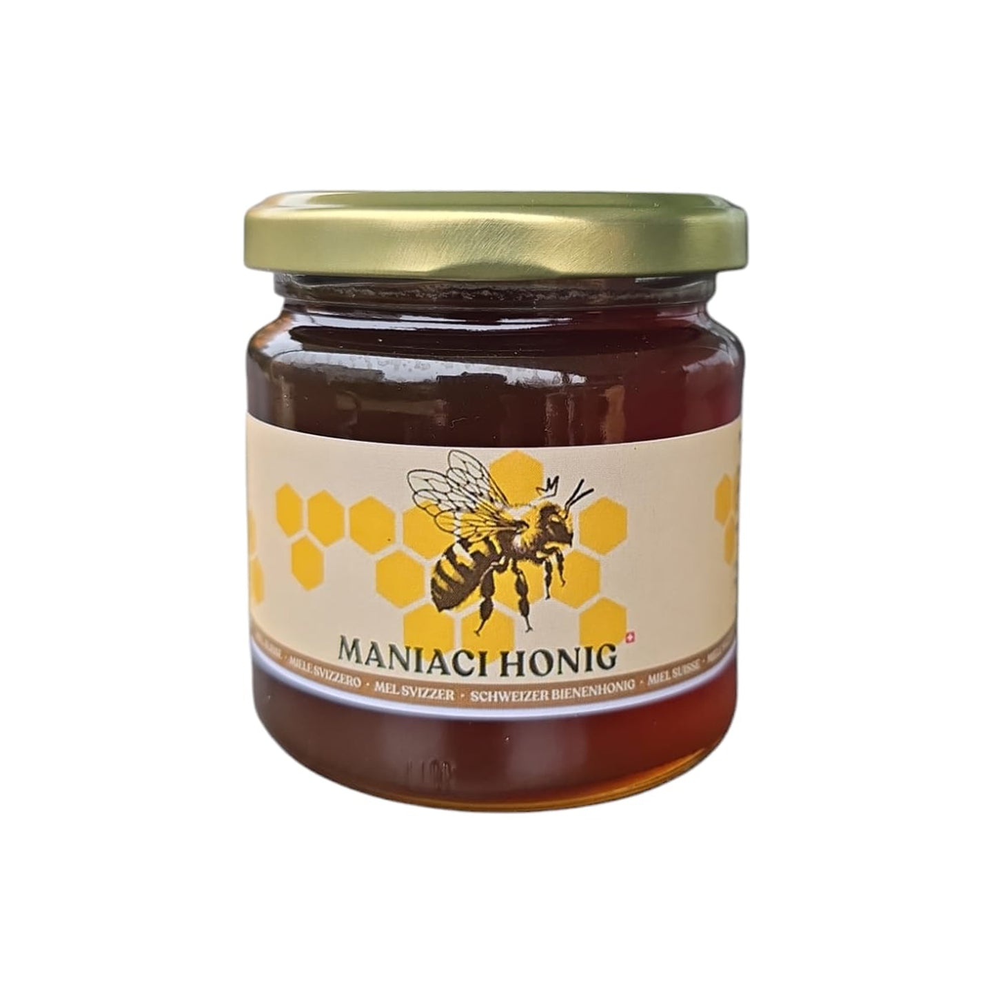Ein Honigglas gefüllt mit Blütenhonig, versehen mit einer Etikette, auf der Maniaci Honig steht.